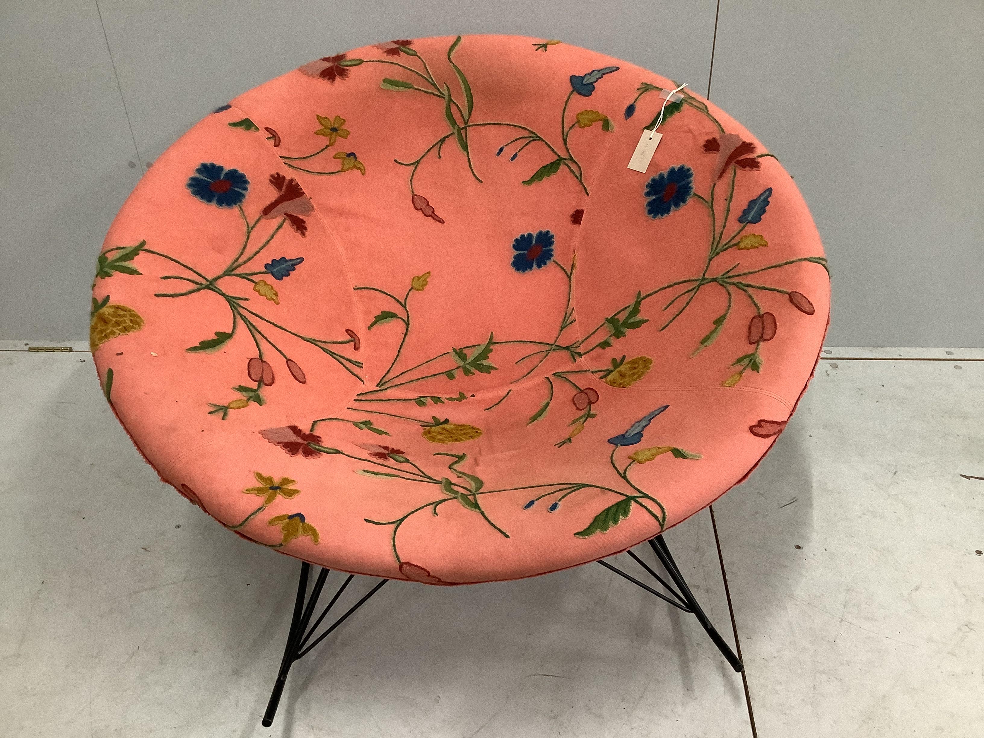 A mid century circular upholstered tub shaped rocking chair, diameter 106cm